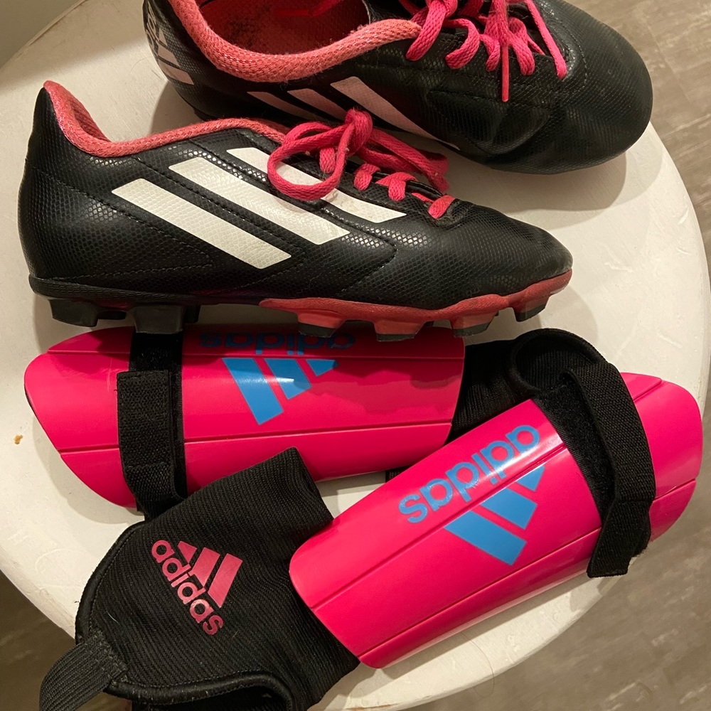 Girls soccer cleats and shin guards